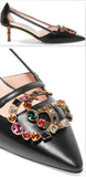 Unia Logo-Embellished Leather Pumps